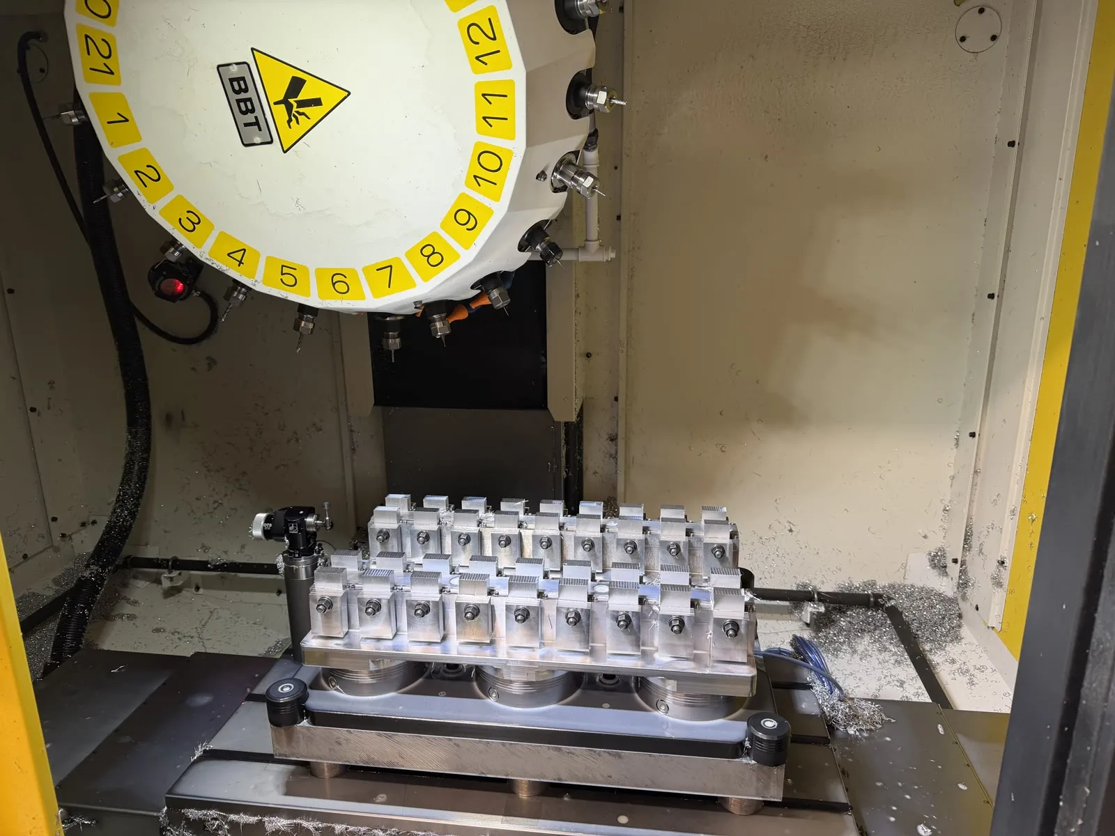 Multi-part fixture with many aluminium blanks inside a FANUC ROBODRILL