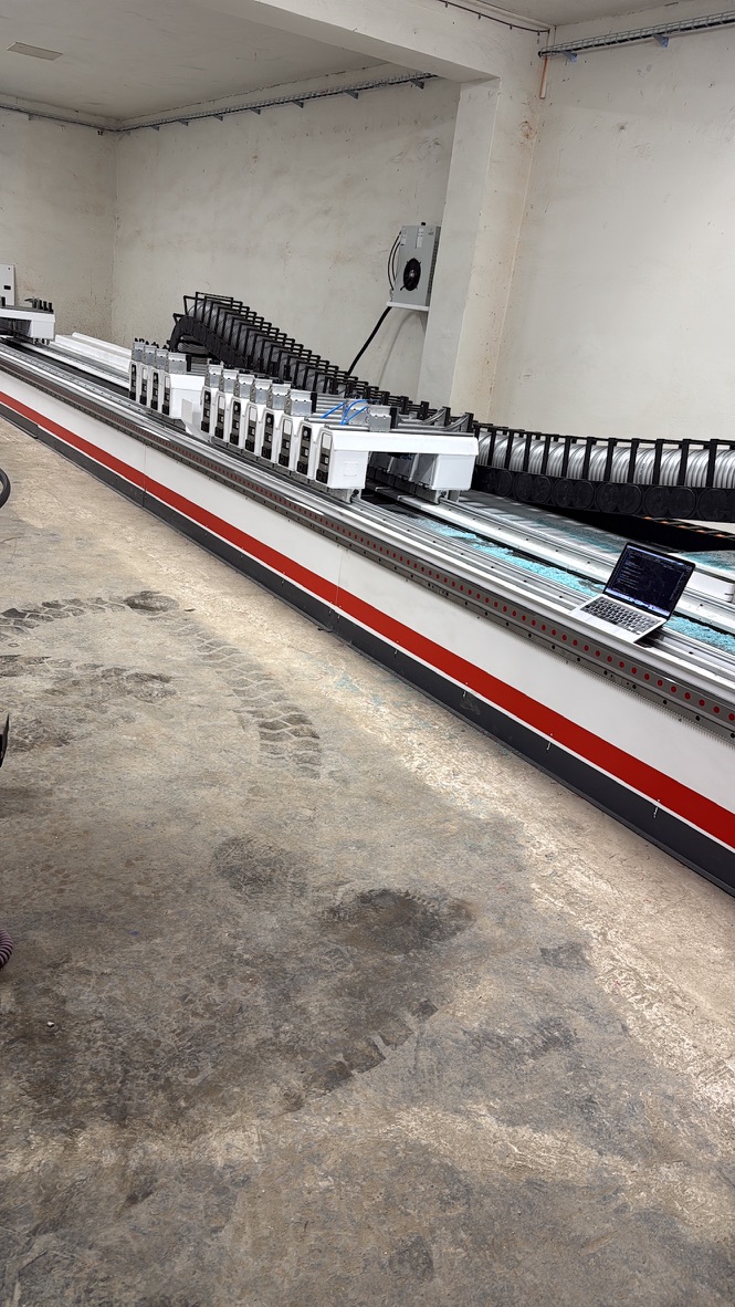 Custom Houfek CNC machining center for plastic profile machining in GDP Koral’s shop
