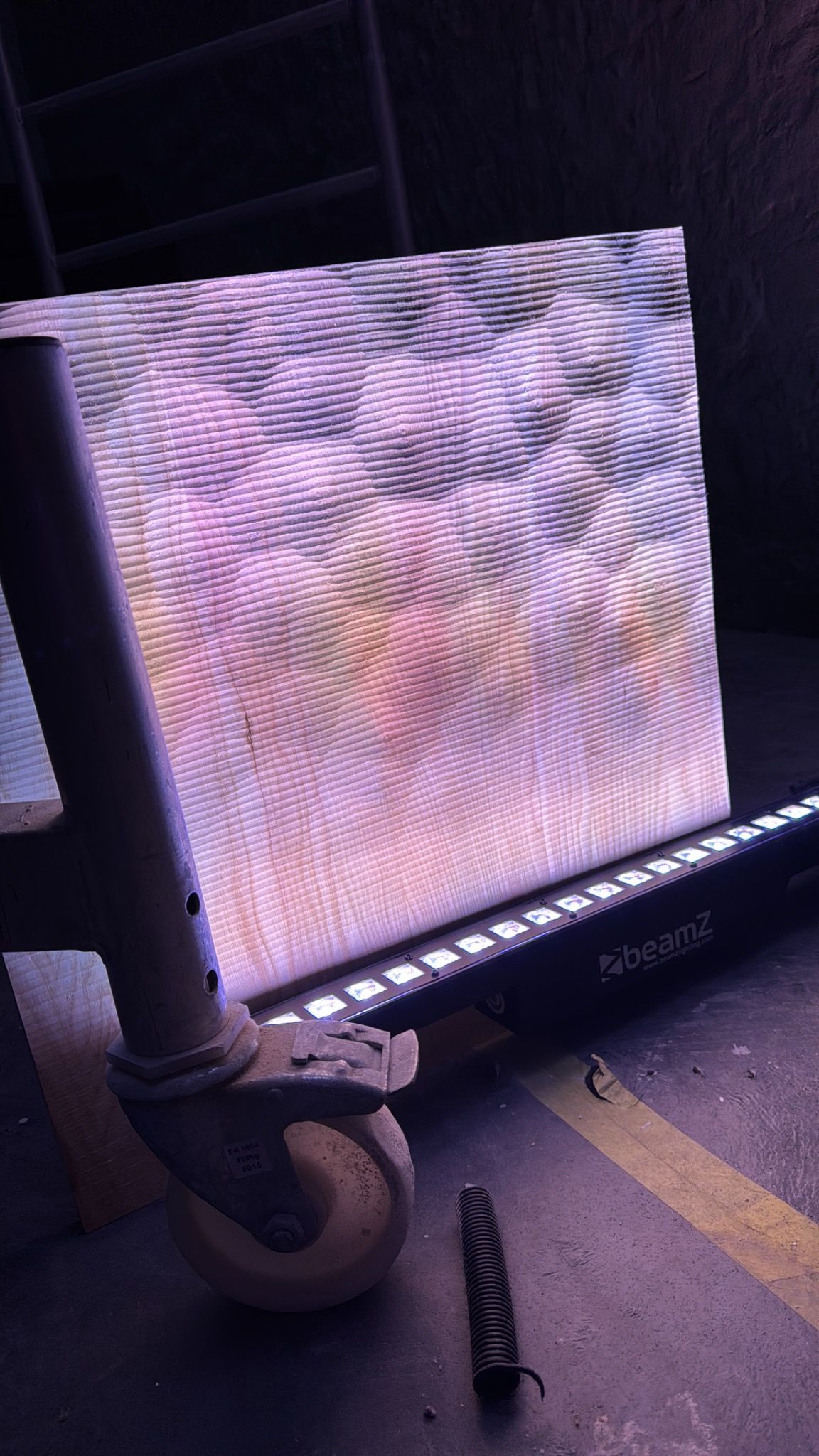 Backlit CNC-machined relief panel showing light and shadow