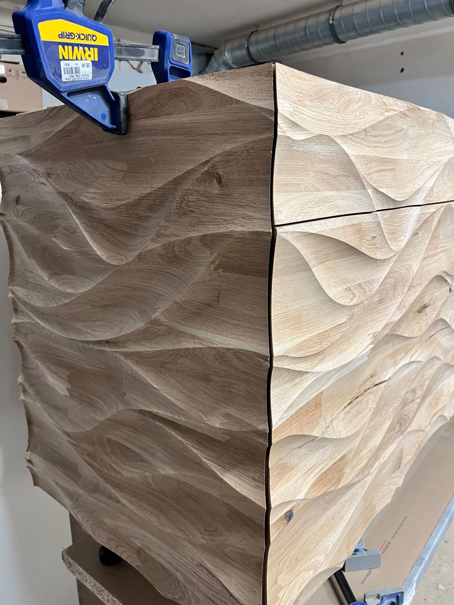 Corner detail and seams between CNC-machined timber relief panels
